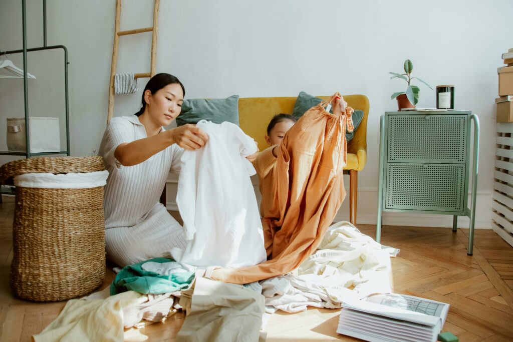 Mother and Daughter Folding Laundry