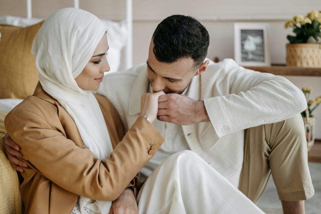 Man Kissing the Hand of a Woman