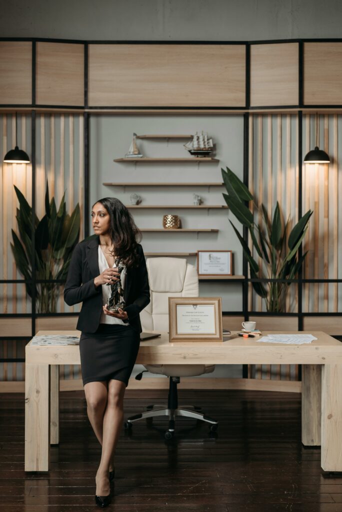 Woman Sitting on Wooden Table